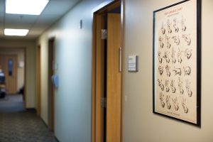 Picture of a hallway in HSDC, with an ASL alphabet poster.